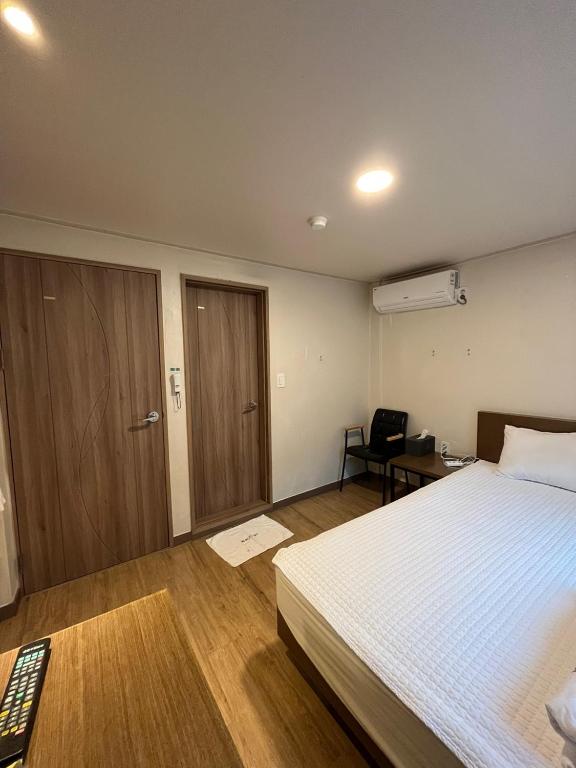Postel nebo postele na pokoji v ubytování Ssangma Motel