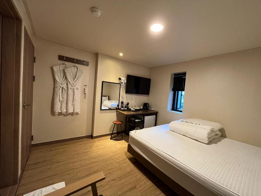 Postel nebo postele na pokoji v ubytování Ssangma Motel
