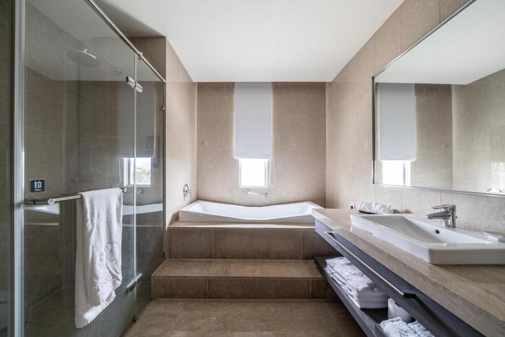 Postel nebo postele na pokoji v ubytování Taipung Suites