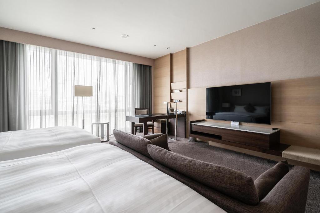 TV a/nebo společenská místnost v ubytování Taipung Suites