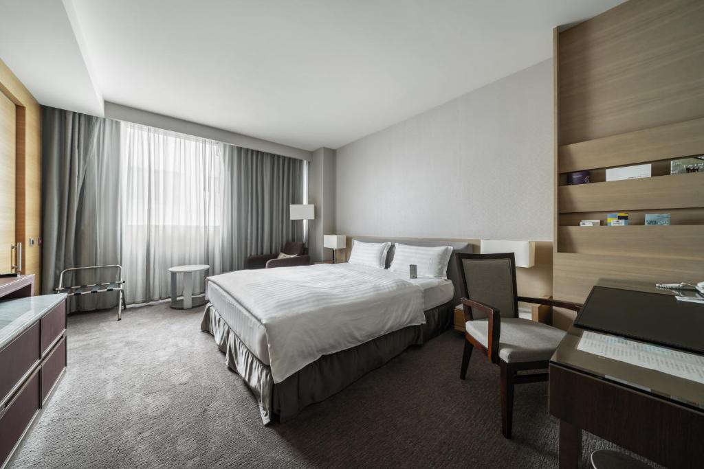 Postel nebo postele na pokoji v ubytování Taipung Suites