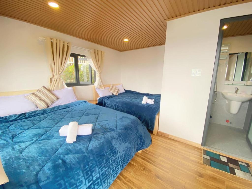 Giường trong phòng chung tại Ngọc Nguyên Homestay