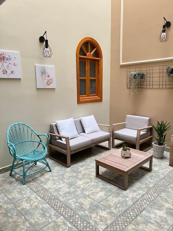 a living room with couches and a coffee table at La casa de Lola in Caleta De Velez