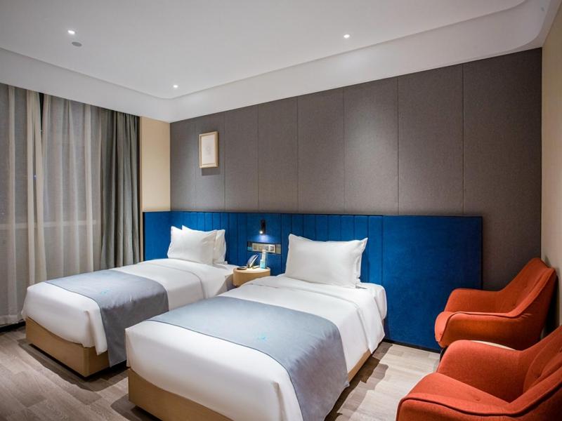 מיטה או מיטות בחדר ב-LanOu Hotel Taiyuan University of Finance and Economics North America N1
