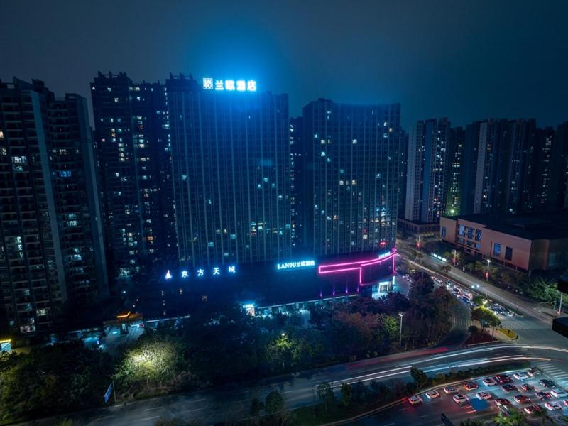 a view of a city at night with tall buildings at LanOu Hotel Qingcheng Municipal Government Shunying Plaza in Qingyuan