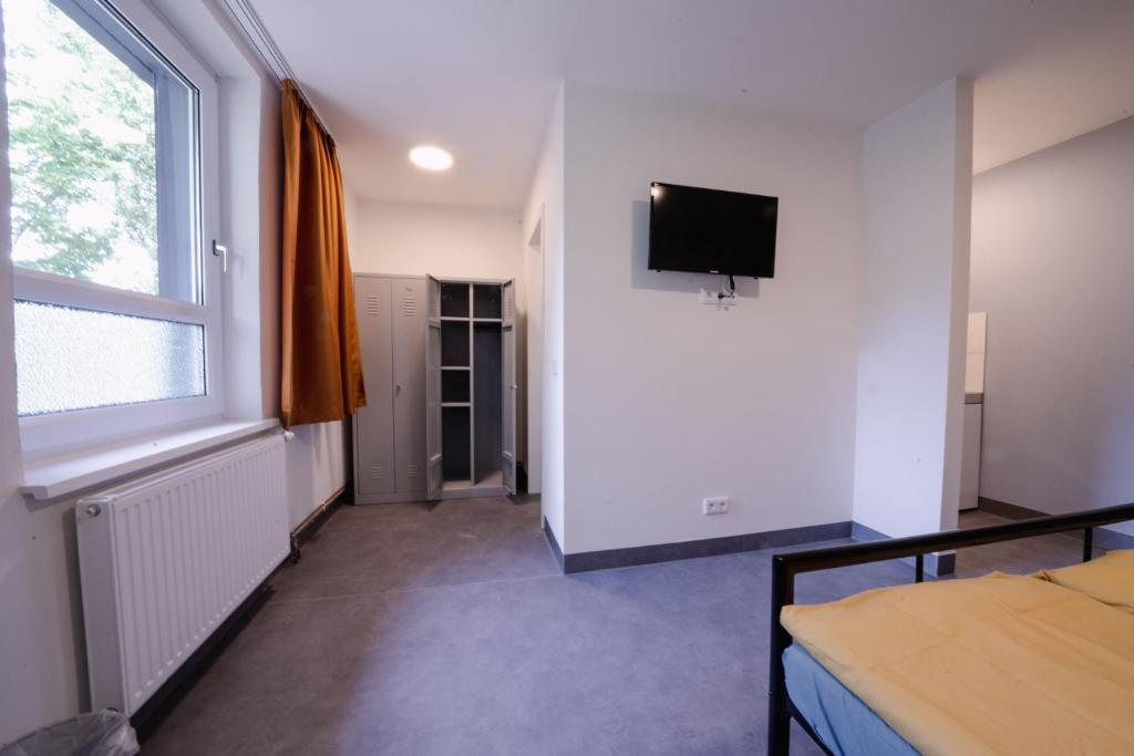 TV a/nebo společenská místnost v ubytování NeoHostel