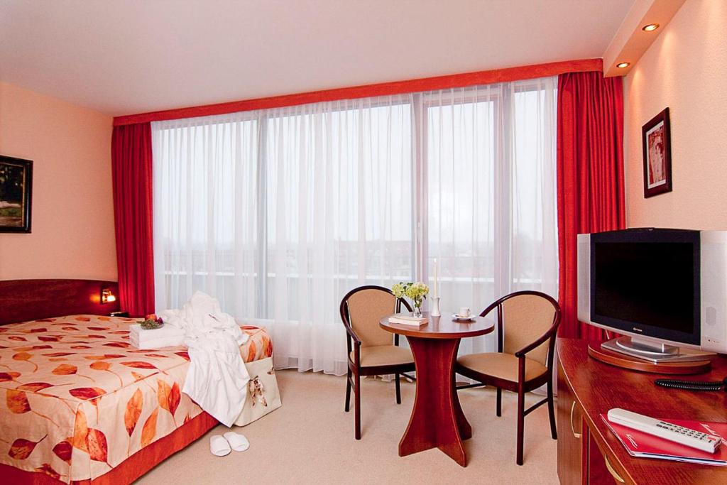 Postel nebo postele na pokoji v ubytování Hotel Balneolum Superior