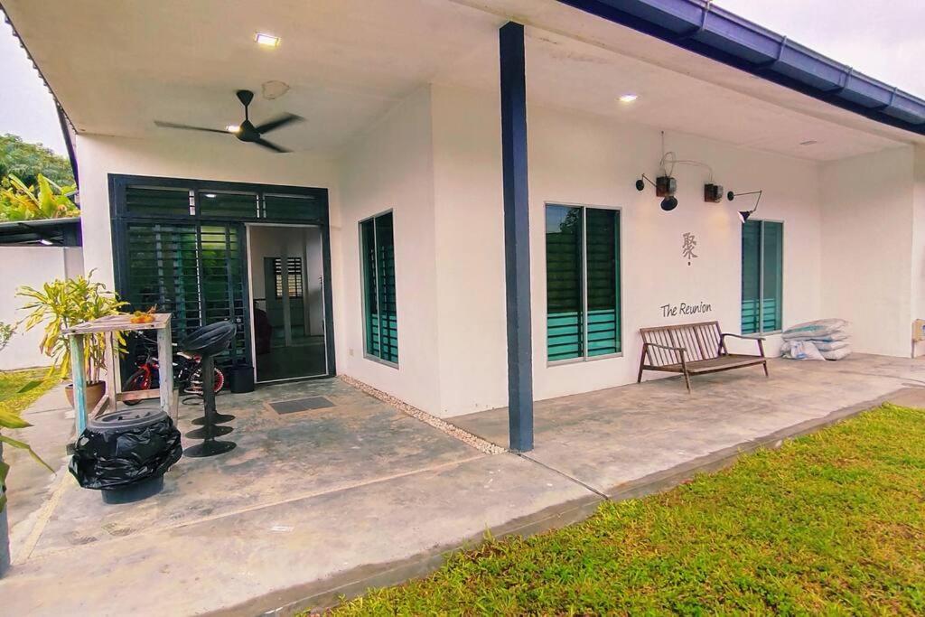 a porch of a white house with a fan at 281 Kulai johor gathering 18pax 5BR near Sawit Mural in Kulai
