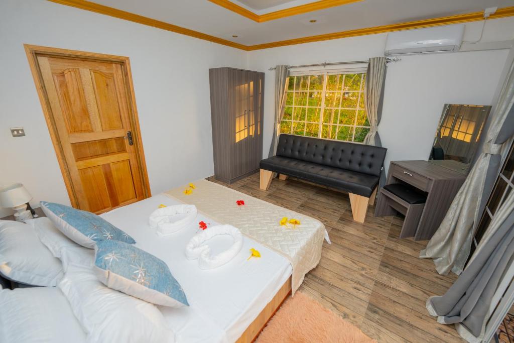 Postel nebo postele na pokoji v ubytování Paradise Breeze Apartment