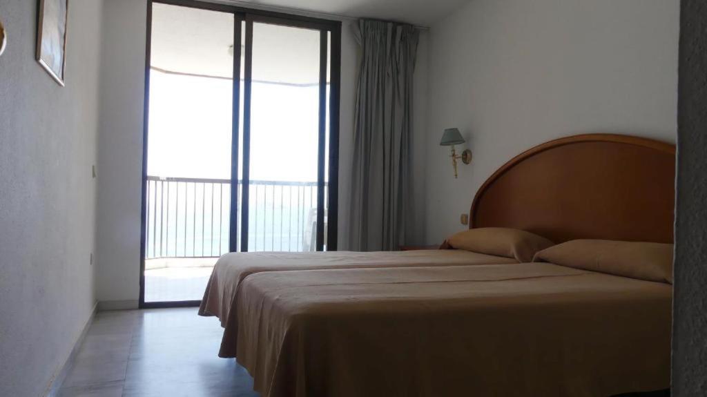 Posteľ alebo postele v izbe v ubytovaní Apartamentos Oasis Benidorm