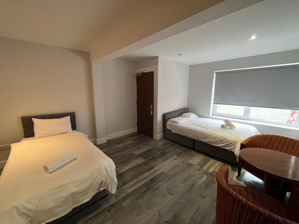 Postel nebo postele na pokoji v ubytování Park View Rooms
