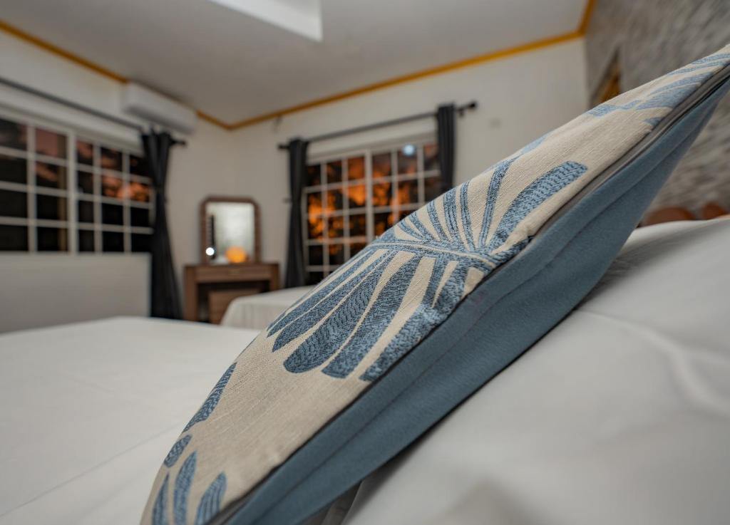 Postel nebo postele na pokoji v ubytování Paradise Breeze Apartment