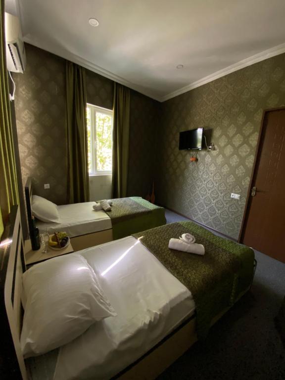 Postel nebo postele na pokoji v ubytování Hotel Shalimar