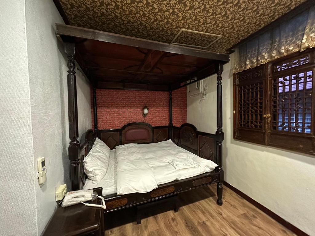 Postel nebo postele na pokoji v ubytování Ming Ren Hotspring Hotel