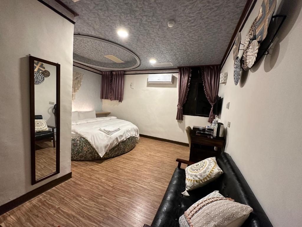 Postel nebo postele na pokoji v ubytování Ming Ren Hotspring Hotel