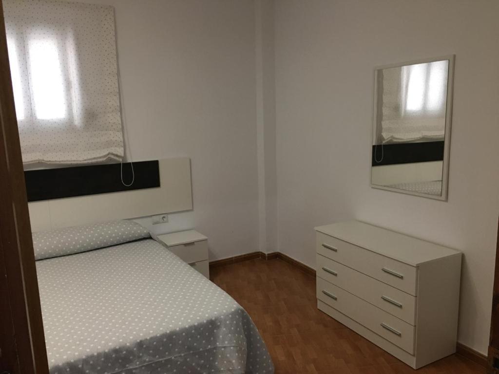 Postel nebo postele na pokoji v ubytování Vivienda con Fines Turísticos Salvador