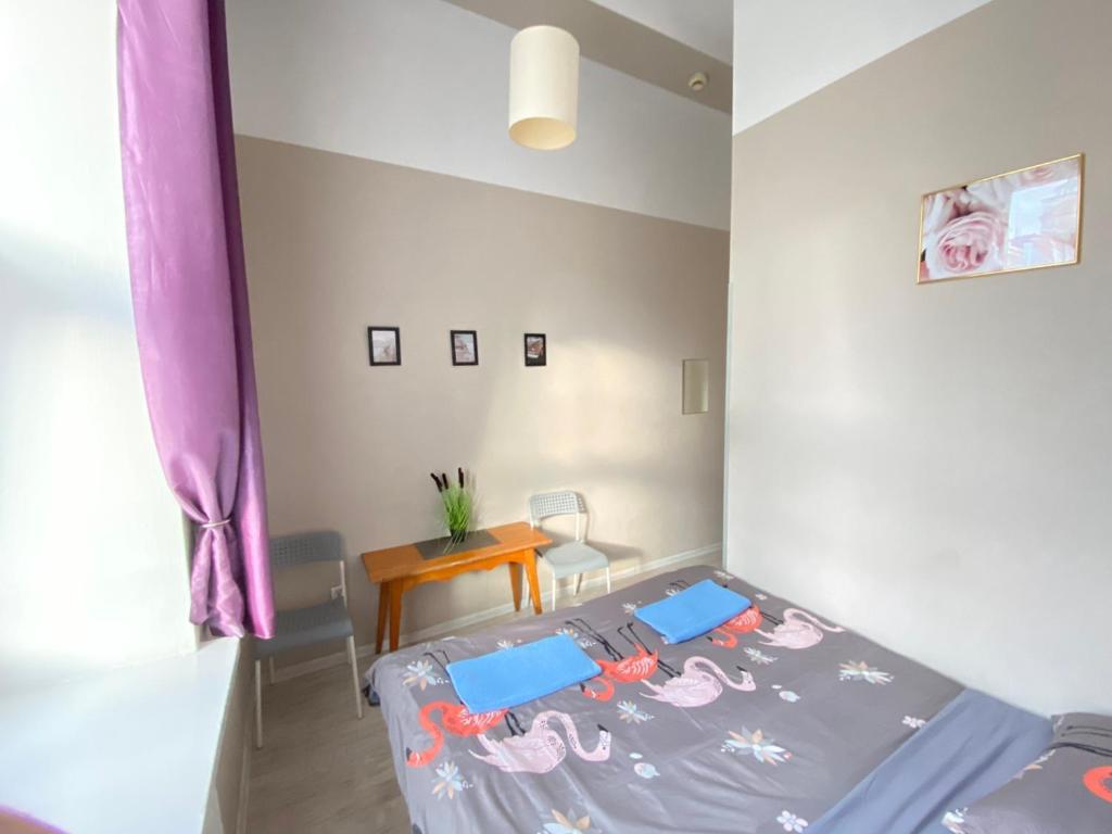 Posteľ alebo postele v izbe v ubytovaní Oliwka Hostel