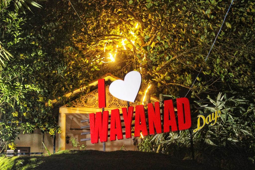 a sign that says i wanted in front of a house at Wayanad Days in Mananthavady