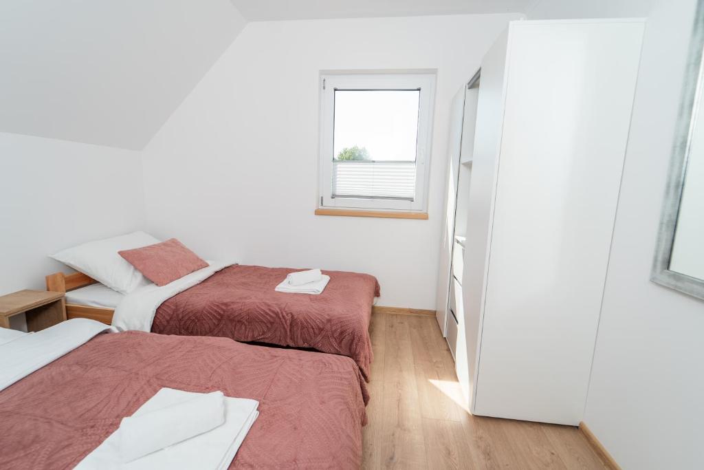 Postel nebo postele na pokoji v ubytování ApartView House Dolina Partecznik by Rent like home
