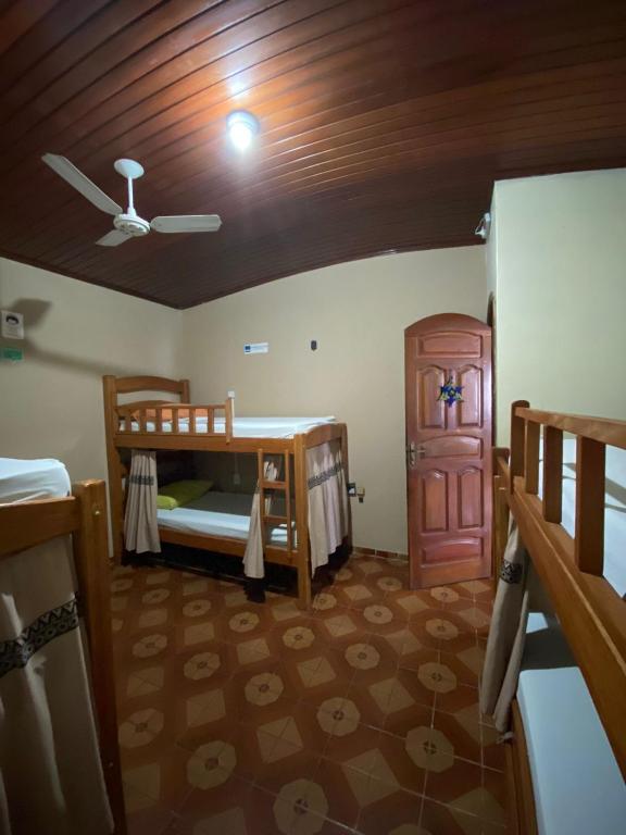 Postel nebo postele na pokoji v ubytování Hostel Roraima