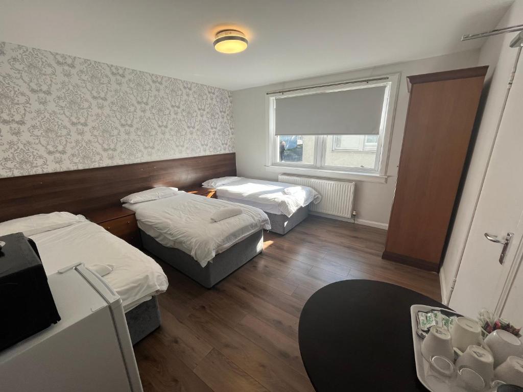 Postel nebo postele na pokoji v ubytování Park View Rooms
