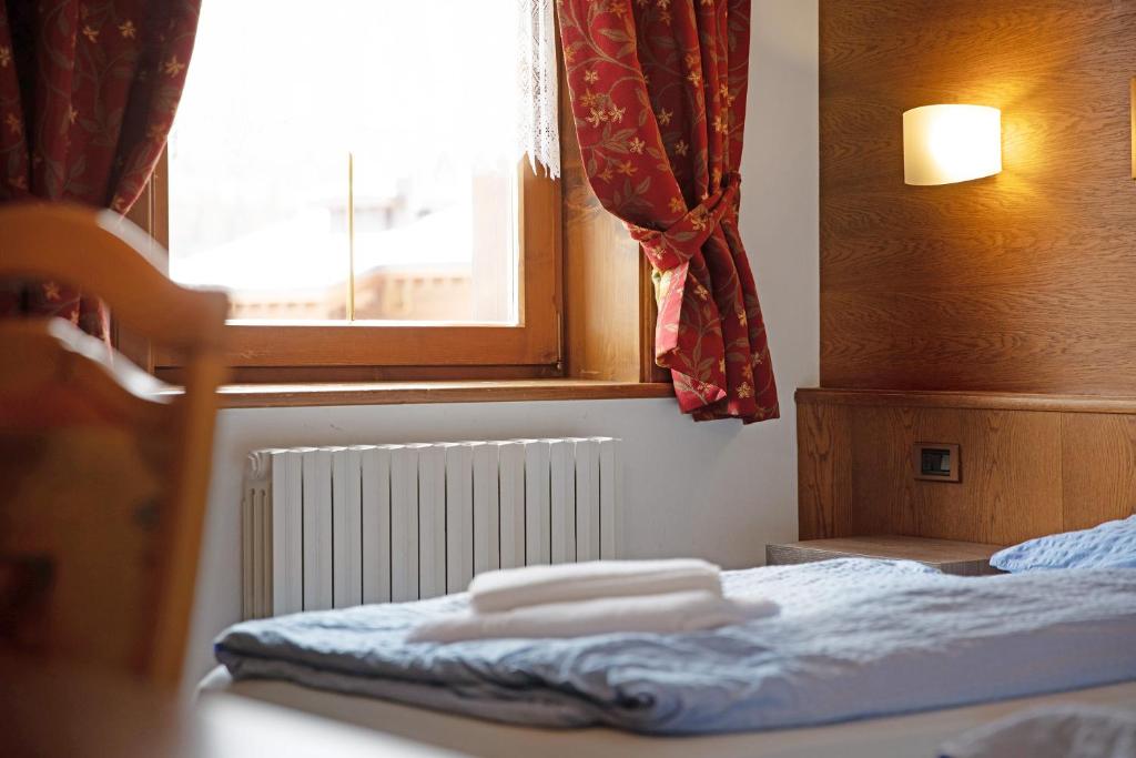 Łóżko lub łóżka w pokoju w obiekcie Casa San Marco n 7