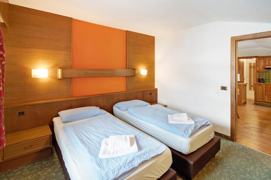 Łóżko lub łóżka w pokoju w obiekcie Casa San Marco n 8
