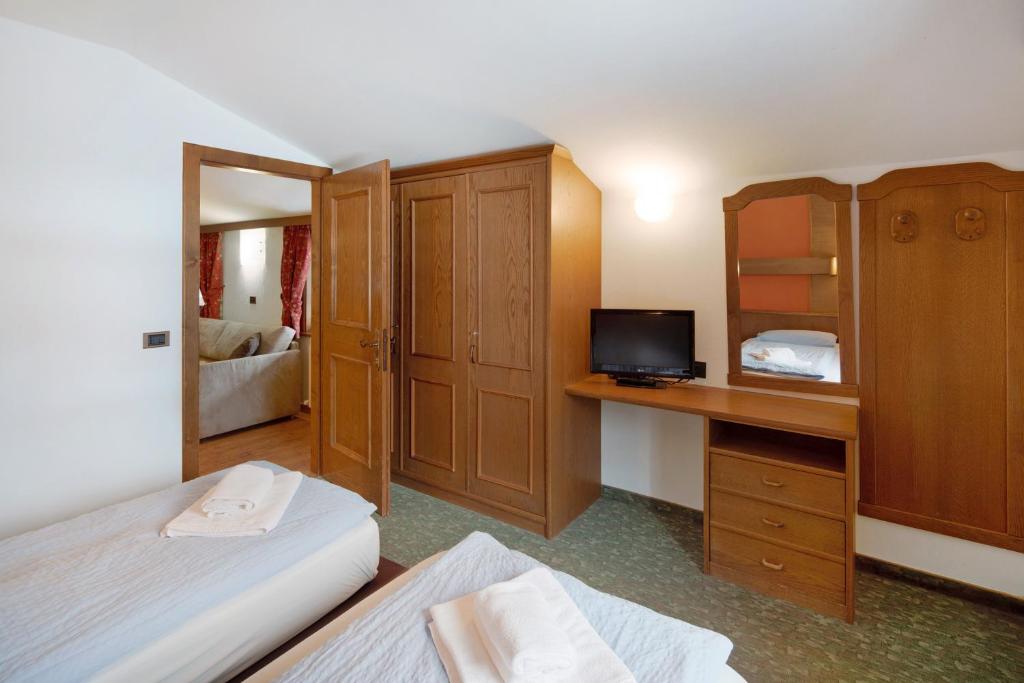 Łóżko lub łóżka w pokoju w obiekcie Casa San Marco n 8