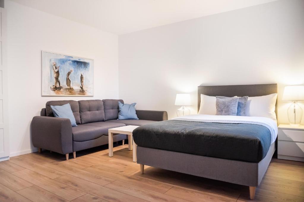 Posteľ alebo postele v izbe v ubytovaní Develia Mała Praga Charming Studio