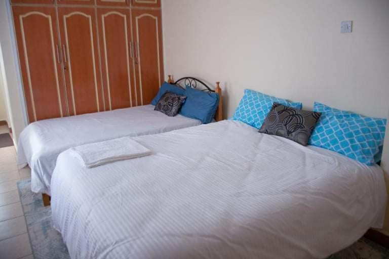 Voodi või voodid majutusasutuse Zoe Homes 3br Mansionette Own Compound Kericho town near Green Square mall toas