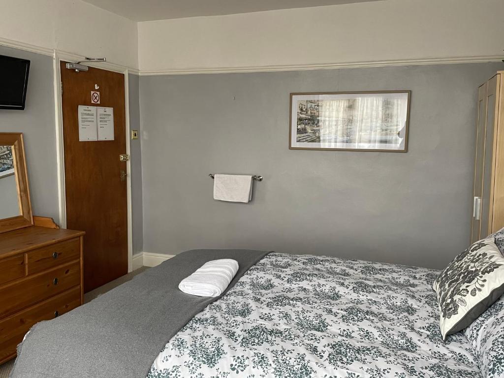 Postel nebo postele na pokoji v ubytování Maple Leaf Guest House