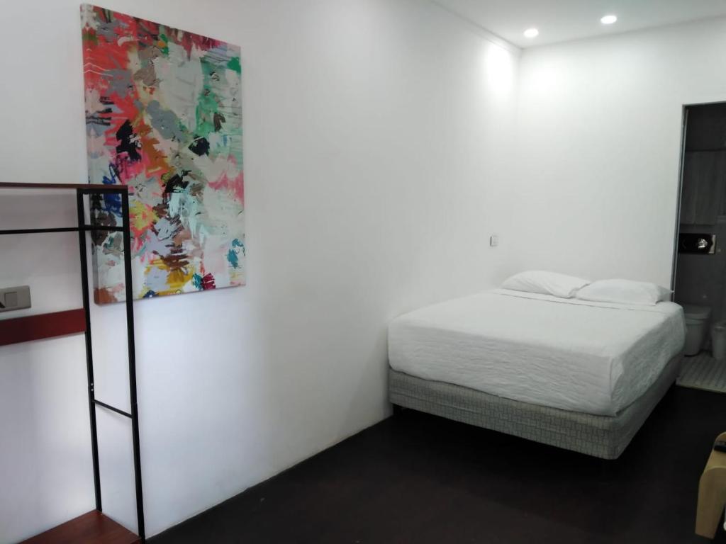 Postel nebo postele na pokoji v ubytování Nomada Republic Hotel Panama City