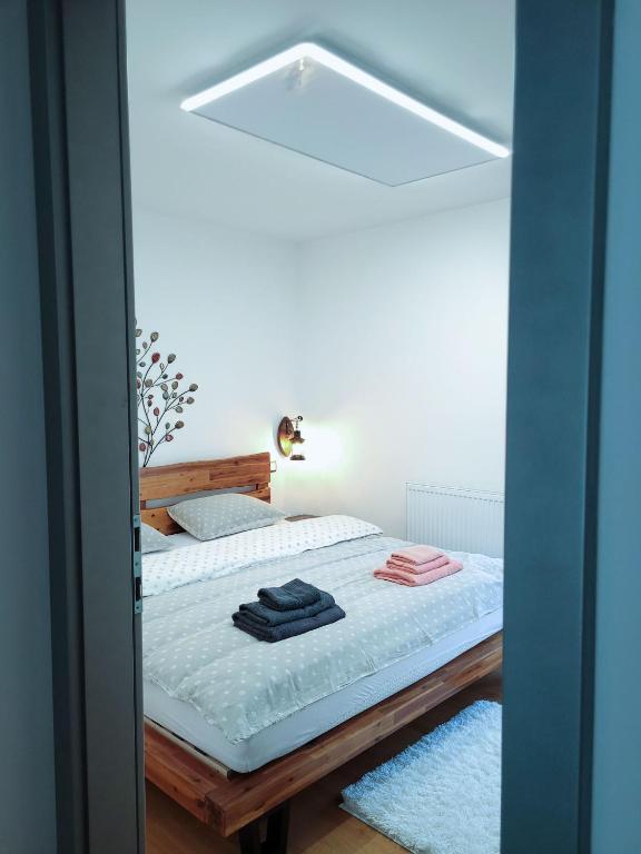 Postel nebo postele na pokoji v ubytování Apartma M&J