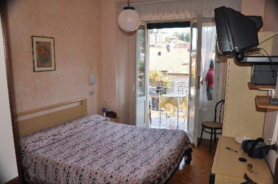 Posteľ alebo postele v izbe v ubytovaní Hotel Elena
