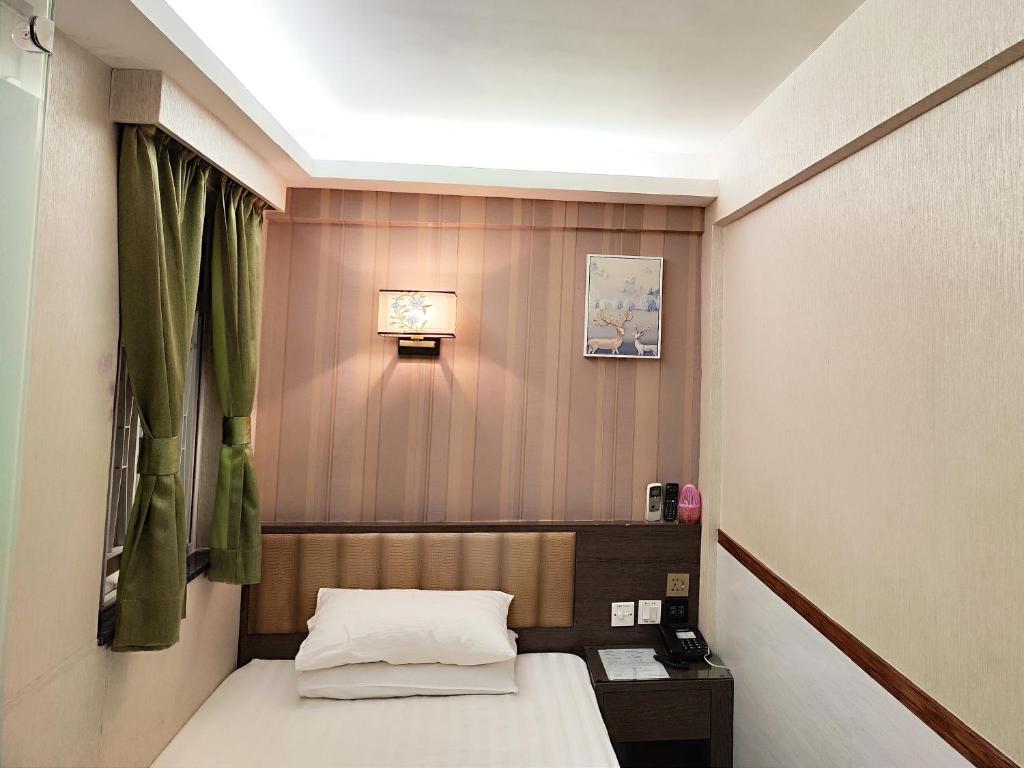 Postel nebo postele na pokoji v ubytování Celltronik Hostel 先創旅店