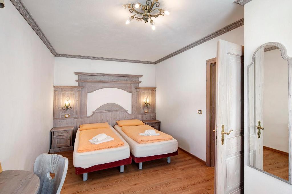 Łóżko lub łóżka w pokoju w obiekcie Casa Li Roina n 47