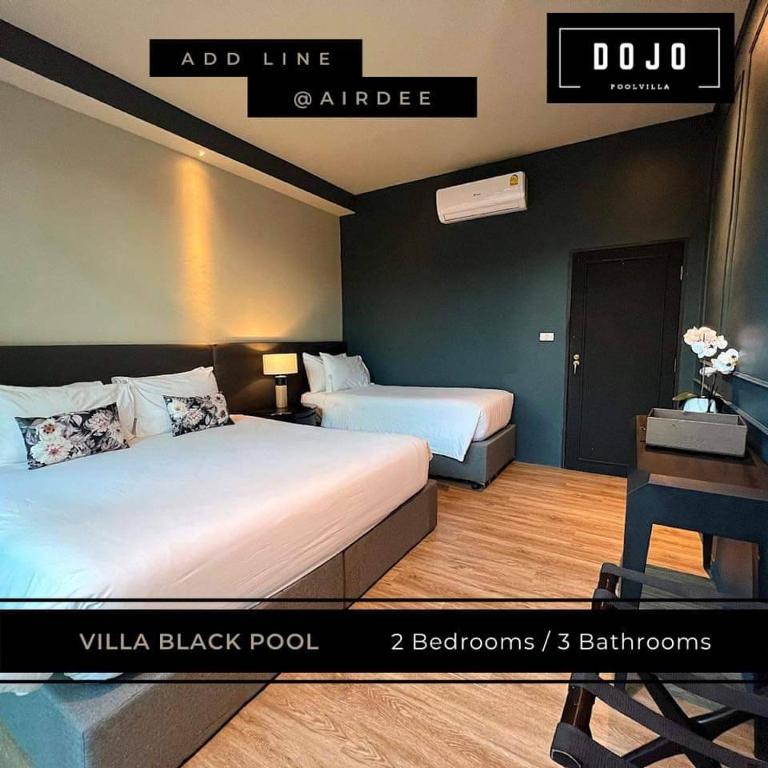 Postel nebo postele na pokoji v ubytování Dojo pool villa