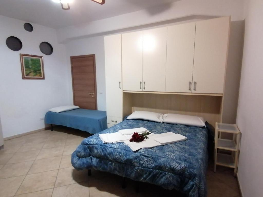 Posteľ alebo postele v izbe v ubytovaní Villa Glori affitto camere monolocali
