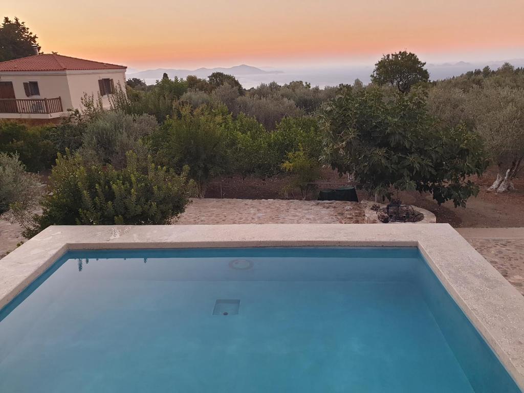 The swimming pool at or close to Chaihoutes stone villa into Olive farm in Zia