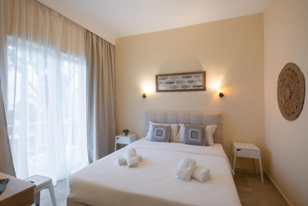 Postel nebo postele na pokoji v ubytování Aurora Beach Hotel