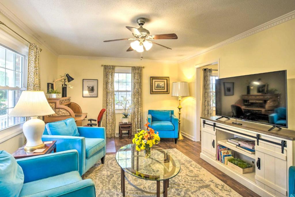 a living room with blue furniture and a ceiling fan at Lovely Taylors Home 8 Mi to Dtwn Greenville! in Greer