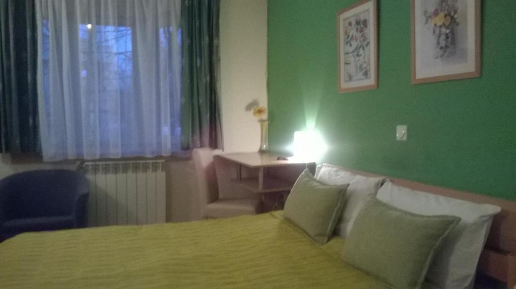 Postel nebo postele na pokoji v ubytování Hotel 7