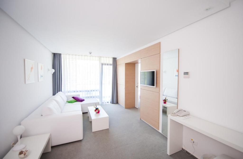 Postel nebo postele na pokoji v ubytování Hotel Melodia