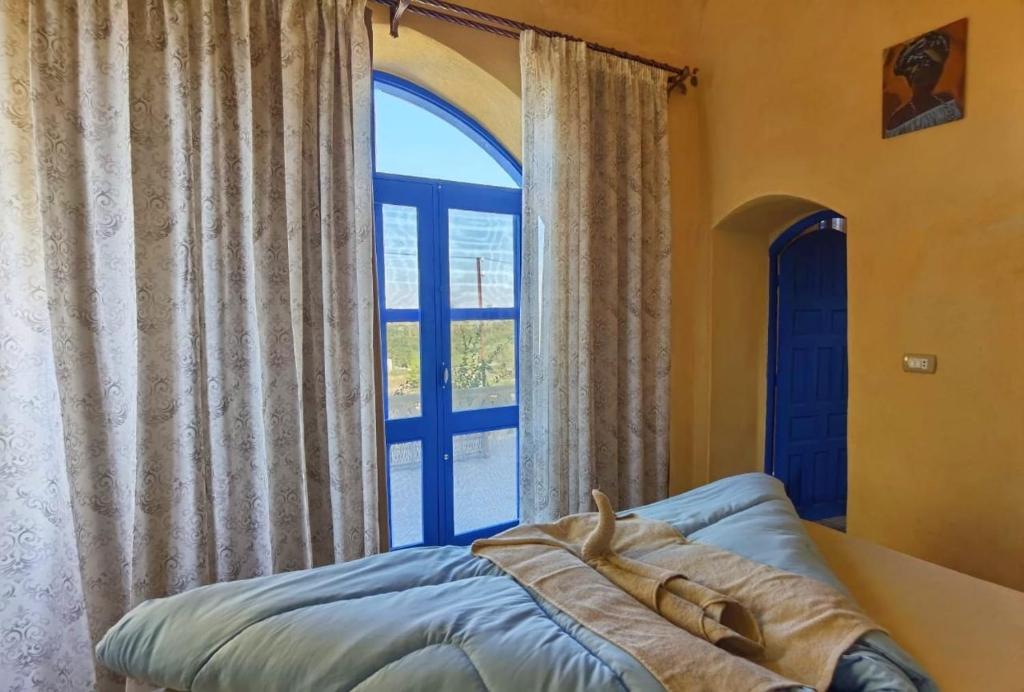 Postel nebo postele na pokoji v ubytování Lemon tree villa