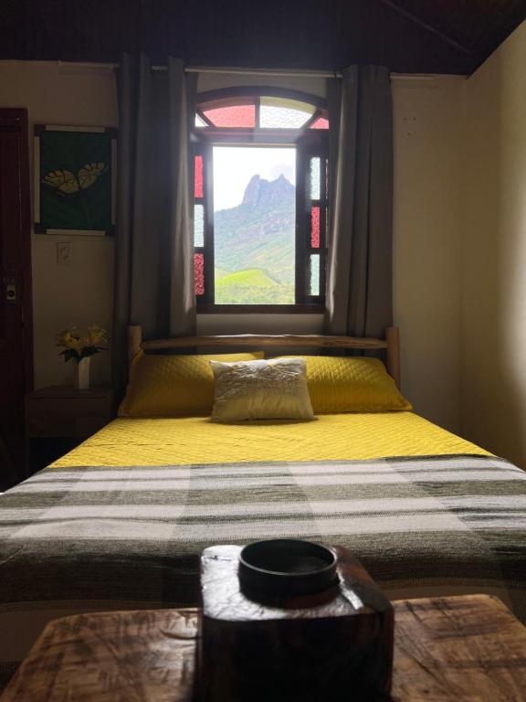 Ένα ή περισσότερα κρεβάτια σε δωμάτιο στο Chales Mirante Pedra Selada