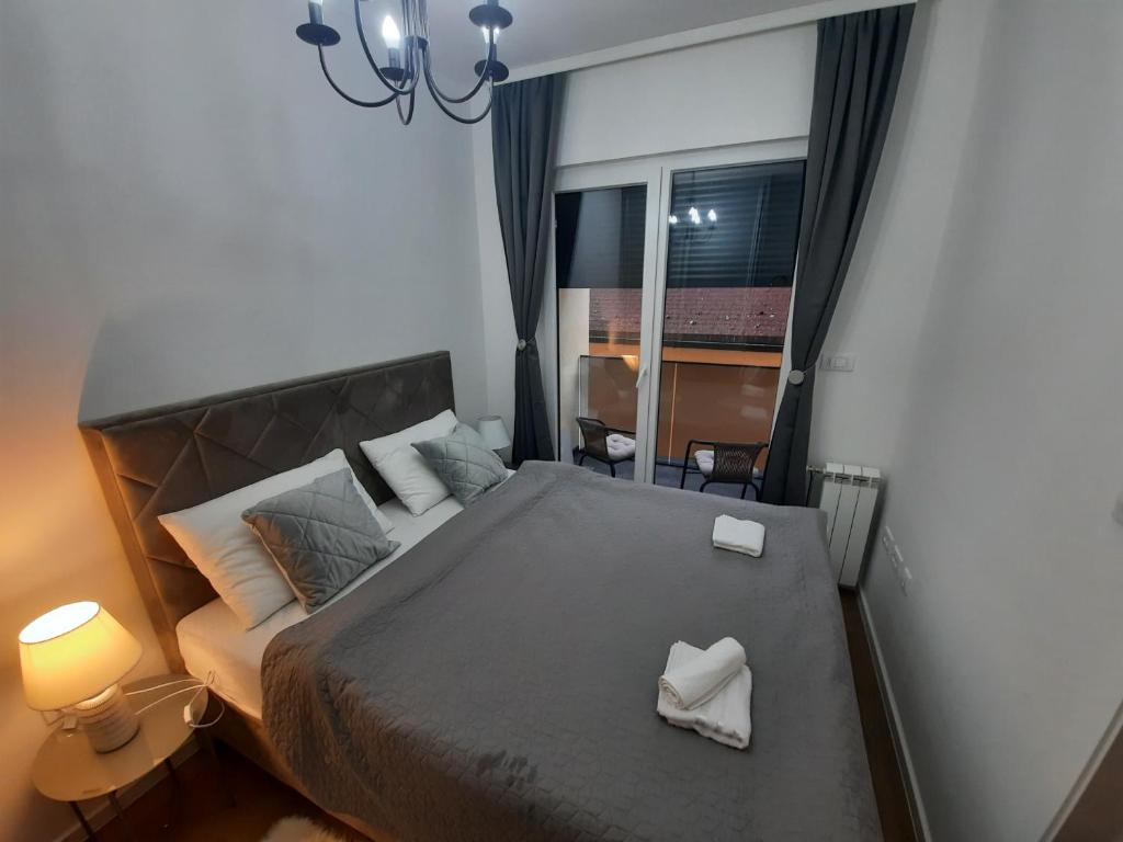 Кровать или кровати в номере Apartman Andjelina