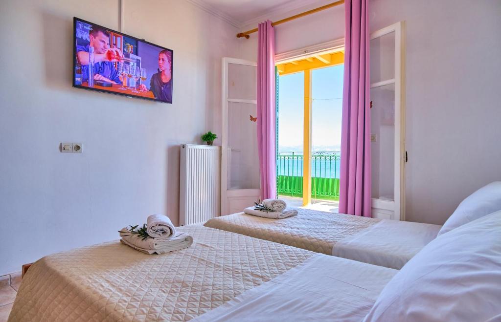 Postel nebo postele na pokoji v ubytování Nikos Kalamaki Corfu