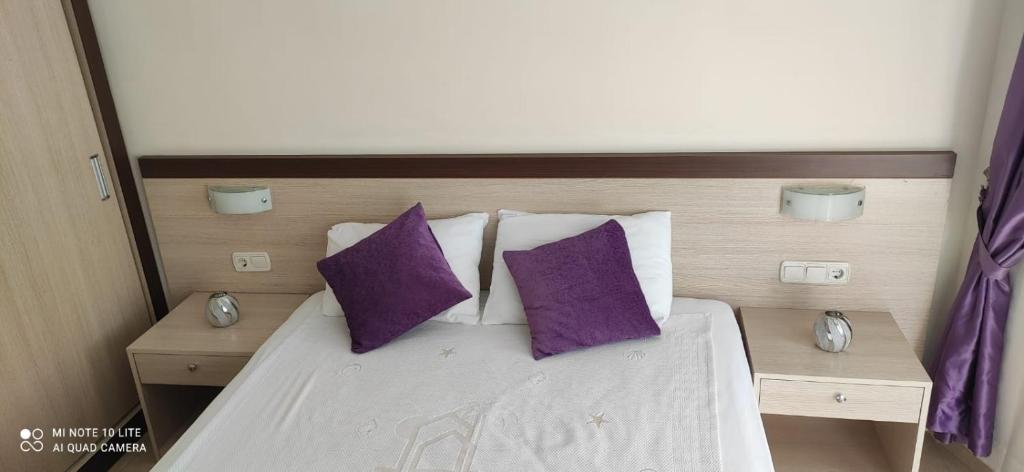 Postel nebo postele na pokoji v ubytování Sırma Hotel