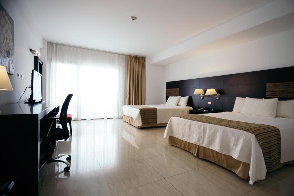 Postel nebo postele na pokoji v ubytování Hotel Balandra