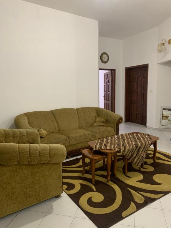 a living room with a couch and a coffee table at Nativity apartment Bethlehem in Bethlehem